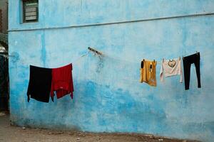 Colourful exterior wall of a Nubian house in Egypt. Typical African village houses facade. Medieval street. photo