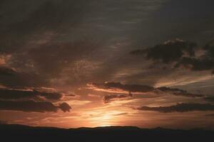 The warm and colorful illumination of the sky during sunset. photo