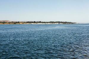 Nile the longest river in Africa. Primary water source of Egypt. Landscape with clear water river. photo