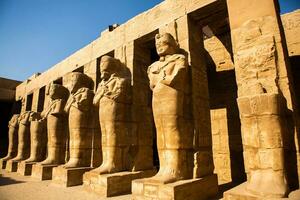 Dendera Temple complex in Egypt. Hieroglypic carvings on wall at the ancient egyptian temple. photo