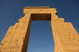 Dendera Temple complex in Egypt. Hieroglypic carvings on wall at the ancient egyptian temple. photo