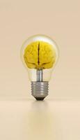 Light bulb with a brain inside illuminated on yellow background. Innovation concept. photo