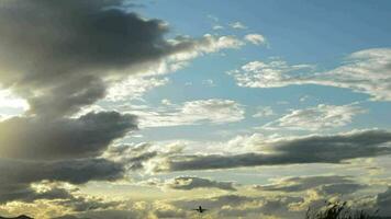 Airplane taking off with clouds in sky at sunset video