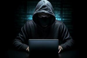 Hooded masked man with a laptop on dark background. Cyber security concept. AI generated photo