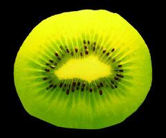 Cut kiwi on black background photo