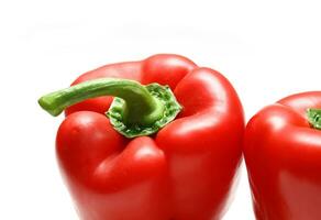 Sweet red peppers on white background photo