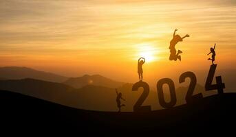 Woman jump happy new year 2024 concept, silhouette of woman jumping over barrier cliff and success with beautiful sunset background. Happy New Year 2023 use for web banner and advertisement. photo