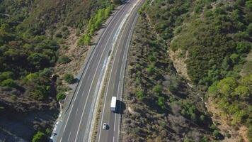 Aerial view of a highway through the mountains video