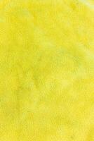 Close up of yellow fabric texture background. Close up of yellow fabric texture. photo