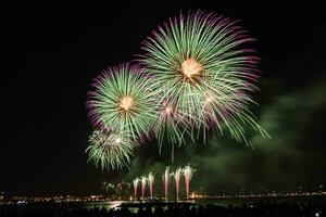 Scenic fireworks at night in the harbor of Cannes, France photo