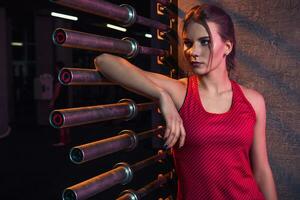 Young beautiful woman posing in a gym outfit. photo