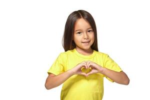 Little girl with her hands in heart-shaped photo