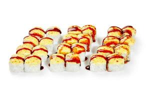 Three types of baked uramaki rolls with melted cheese and unagi sauce photo