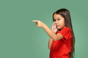 Young girl in red t-shirt is afraid of something photo