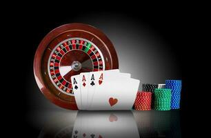 Four aces standing on mirror surface with backlight, ahead of brown roulette and chips in piles. Black background. Gambling entertainment. Close-up. photo