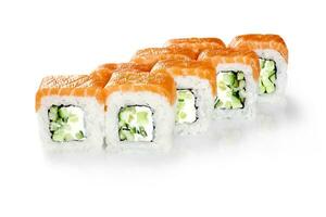 Philadelphia sushi rolls with cream cheese and cucumbers topped with salmon fillet photo