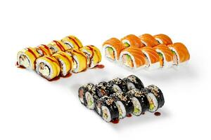 Yin and Yang shaped sushi rolls and uramaki in salmon and cheddar photo