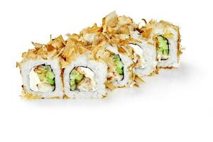Rolls with baked eel, cream cheese and cucumbers topped with bonito flakes photo