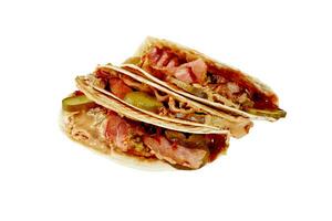 Tacos in wheat tortillas with grilled bacon, pickled cucumbers and peanut butter photo