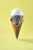 Led lamp in ice cream cone, innovation concept photo