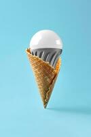 Led lamp in ice cream cone, innovation concept photo