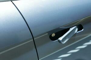 Modern door handle electric car. Smart retractable door handles. EV car door handle. photo