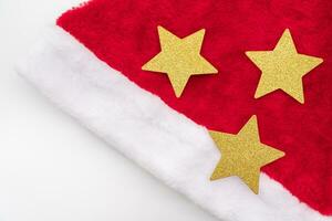 Santa Claus red hat and Gold Star isolated on white background. Christmas background. photo