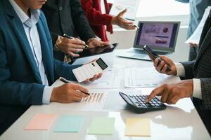 group businessmen and investors met together in conference room to view annual results their investments in business together in order to plan marketing doing business that would produce better result photo