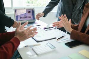 group businessmen and investors met together in conference room to view annual results their investments in business together in order to plan marketing doing business that would produce better result photo