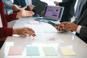 group businessmen and investors met together in conference room to view annual results their investments in business together in order to plan marketing doing business that would produce better result photo