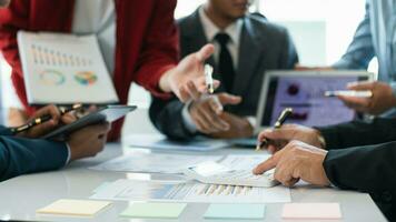 group businessmen and investors met together in conference room to view annual results their investments in business together in order to plan marketing doing business that would produce better result photo