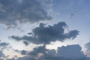 evening sky with fluffy rain cloud in soft blurred style. photo