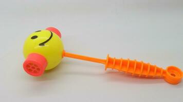 Yellow toy hammer isolated photo