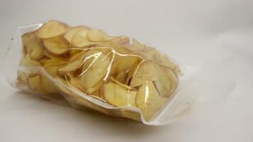 Cassava chips packaged using plastic. photo