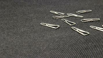 Close up of paper clips scattered photo