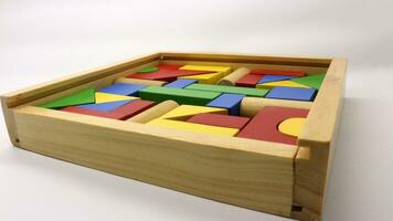 Colorful wooden puzzle toys are neatly arranged photo