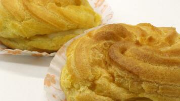 Two traditional cake Cream puffs photo