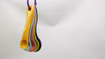 Measuring spoons in various colors photo