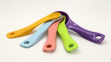 Measuring spoons in various colors photo