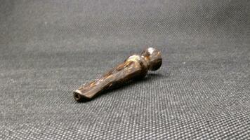 Indonesian wooden pipe for smoking photo