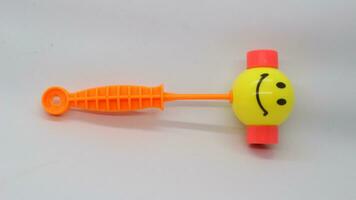 Yellow toy hammer isolated photo