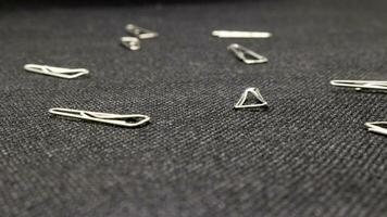 Close up of paper clips scattered photo