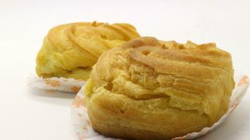 Two traditional cake Cream puffs photo