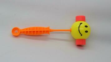 Yellow toy hammer isolated photo