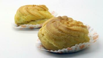 Two traditional cake Cream puffs photo