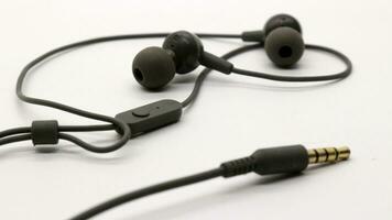 Close up of black wired earphones photo