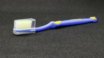 Close up blue toothbrush with cover photo