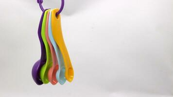 Measuring spoons in various colors photo