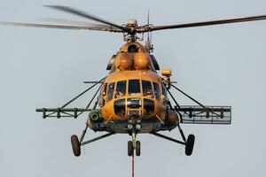 Untitled military helicopter at air base. Air force and army flight transportation. Aviation and rotorcraft. Transport and airlift. Military industry. photo