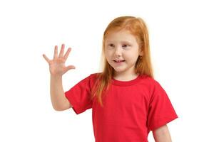 A little girl shows gesture - five fingers, isolated on white background photo